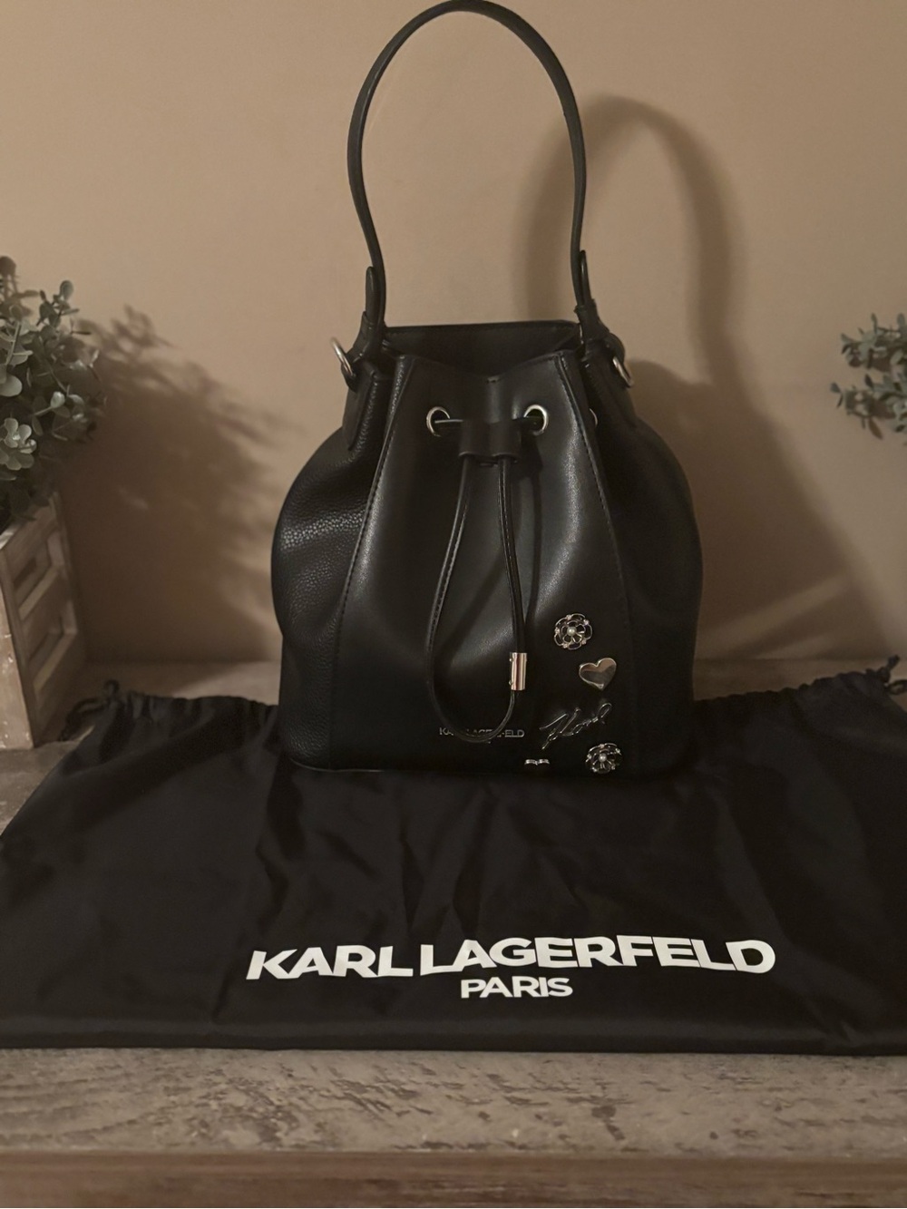 Karl Lagerfeld Black faux Leather Drawstring Bucket Bag with Charm Accents